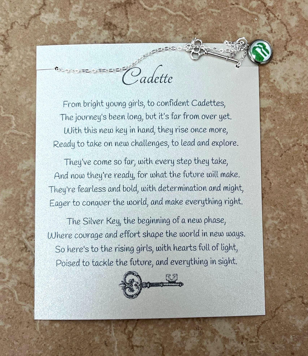 Silver Key Charm Necklace on Card Stock